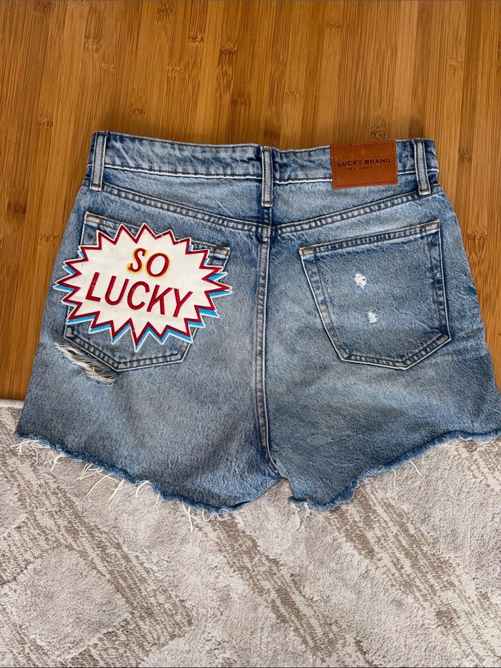 Lucky Brand Light Blue Denim Cutoff Shorts with 'So Lucky' Patch